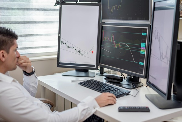 Cryptocurrency trading desk with live market charts