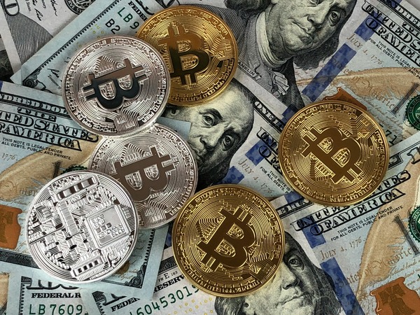 Stack of cryptocurrency coins representing UNI holdings